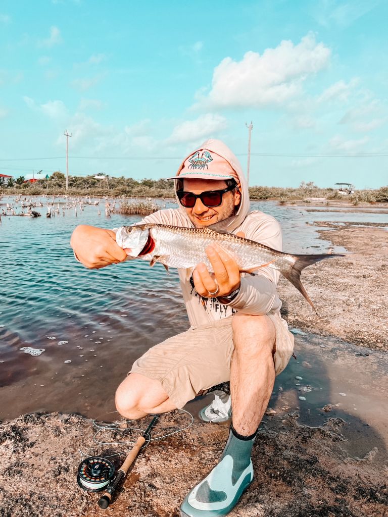Andy and a baby tarpon while wade fishing in the ponds