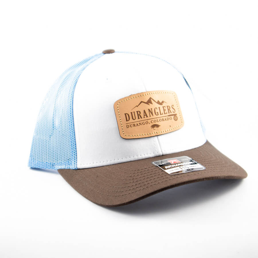 https://duranglers.com/wp-content/uploads/2024/03/Duranglers-Logo-Low-Pro-Trucker-Cap-white-blue-brown-leather-patch-small-and-large.jpg